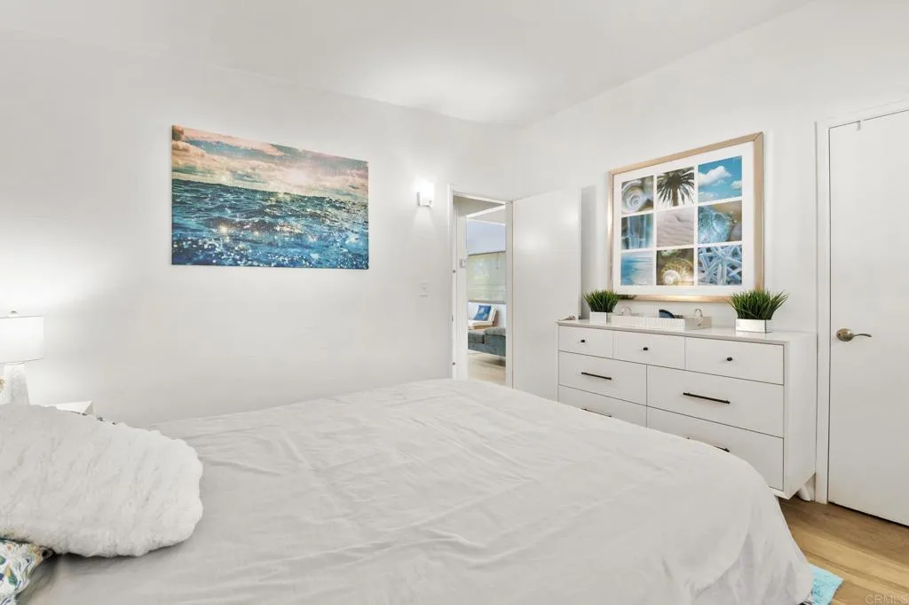 1153 Aloha Drive Encinitas, CA 92024 - Photo 14 of 50 a bedroom with a bed and a window