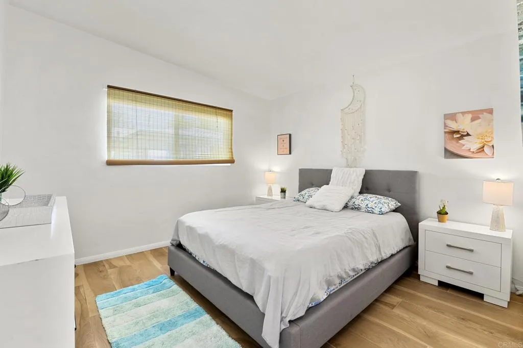 1153 Aloha Drive Encinitas, CA 92024 - Photo 15 of 50 a bedroom with a bed and a couch