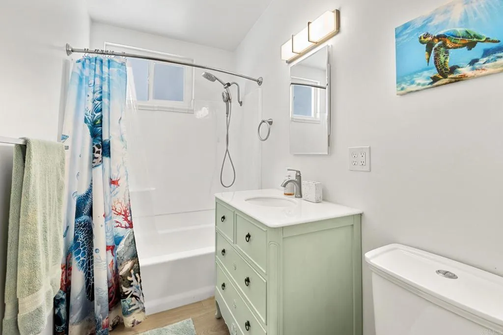1153 Aloha Drive Encinitas, CA 92024 - Photo 17 of 50 a bathroom with a sink a toilet and a shower