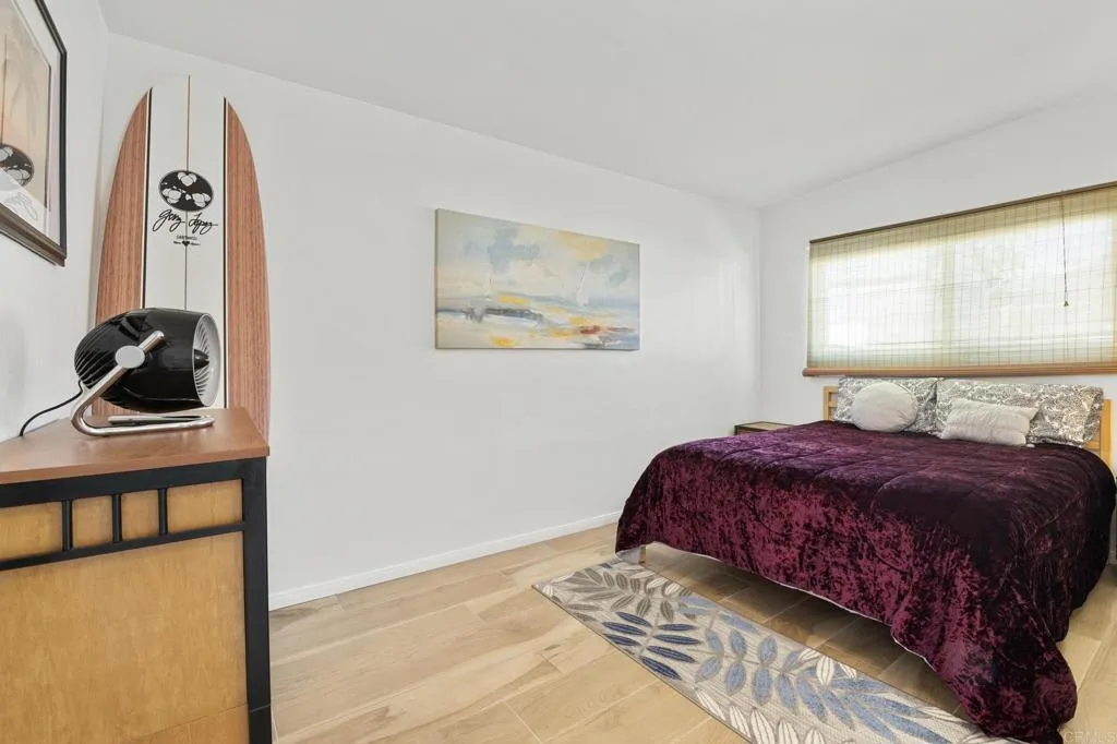 1153 Aloha Drive Encinitas, CA 92024 - Photo 19 of 50 a bedroom with a bed and a window