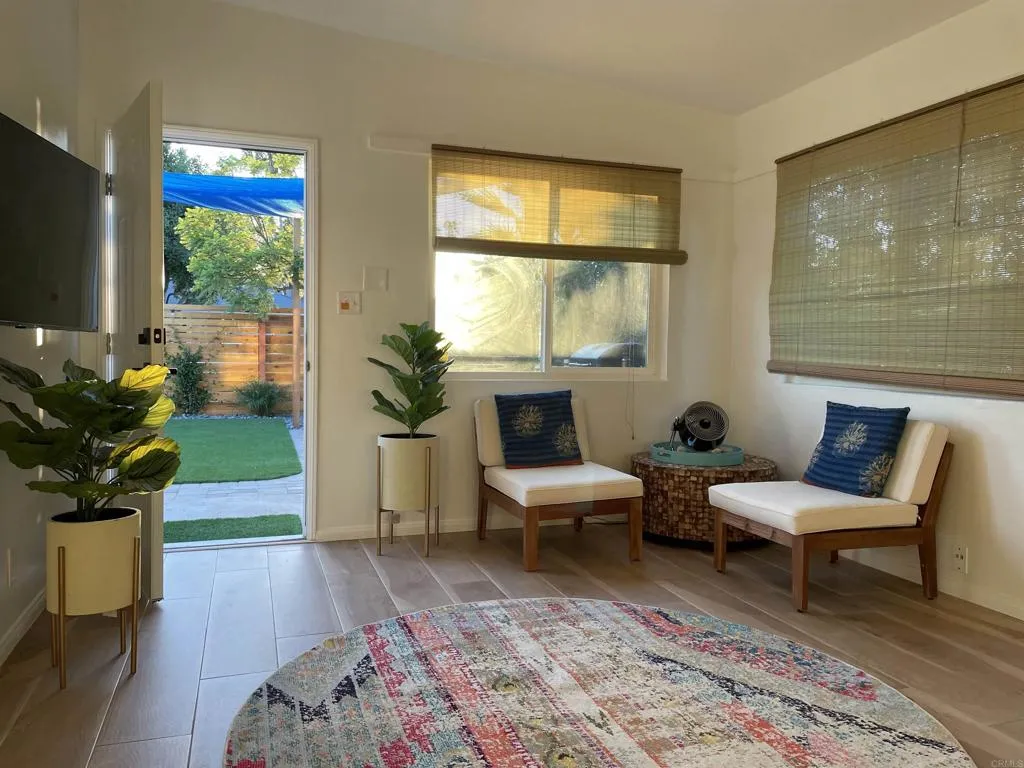 1153 Aloha Drive Encinitas, CA 92024 - Photo 20 of 50 a living room with furniture and a flat screen tv