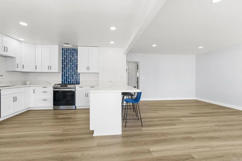 1153 Aloha Drive Encinitas, CA 92024 - Photo 23 of 50 a kitchen with a table and chairs in it