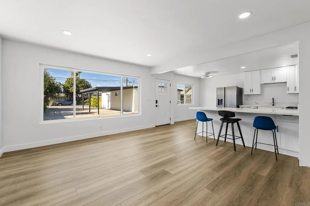 1153 Aloha Drive Encinitas, CA 92024 - Photo 27 of 50 a living room with furniture and a wooden floor