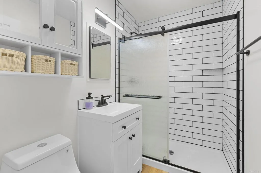 1153 Aloha Drive Encinitas, CA 92024 - Photo 32 of 50 a bathroom with a sink a toilet and shower