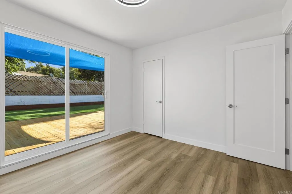 1153 Aloha Drive Encinitas, CA 92024 - Photo 34 of 50 a view of empty room with wooden floor and fan