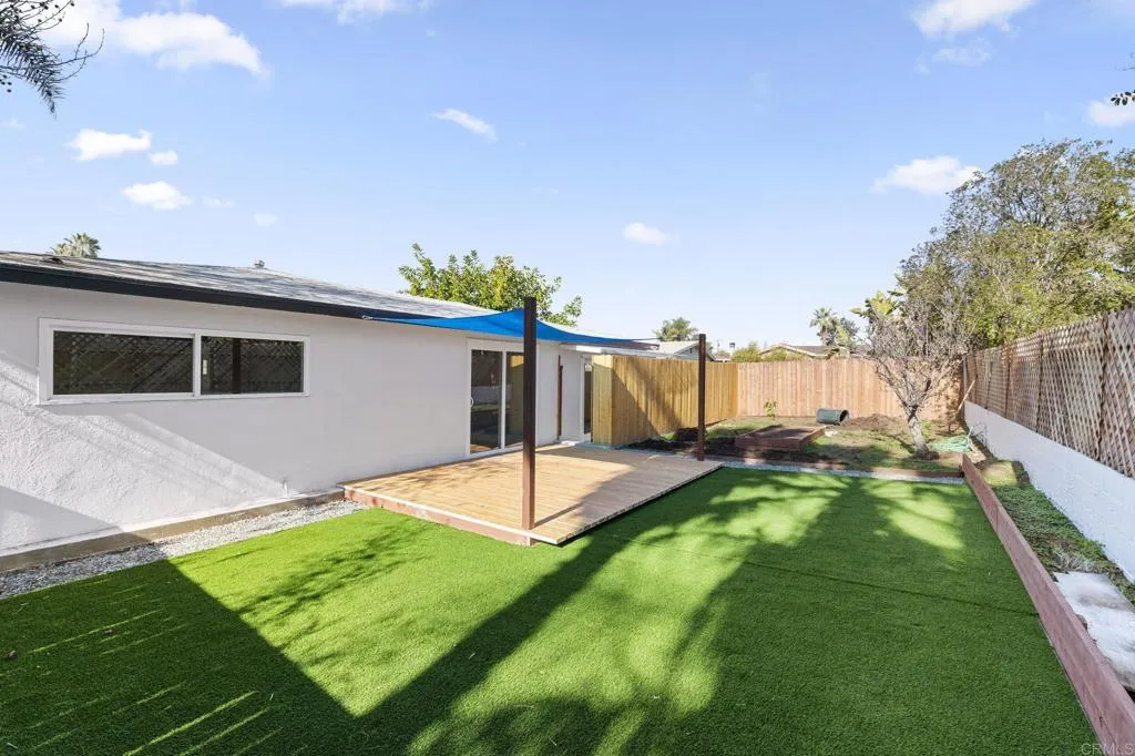 1153 Aloha Drive Encinitas, CA 92024 - Photo 35 of 50 a backyard of a house with table and chairs