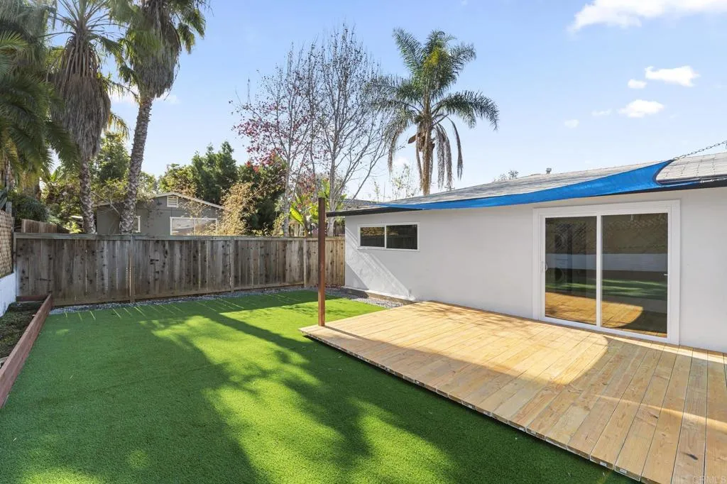 1153 Aloha Drive Encinitas, CA 92024 - Photo 37 of 50 a backyard of a house with table and chairs