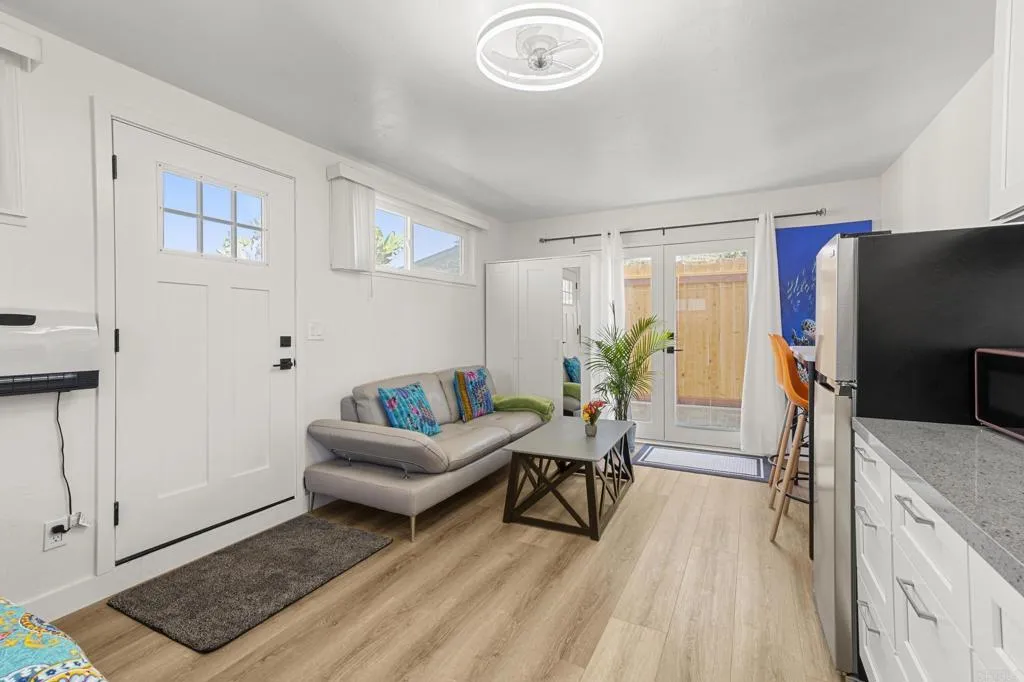 1153 Aloha Drive Encinitas, CA 92024 - Photo 42 of 50 a living room with furniture and a flat screen tv