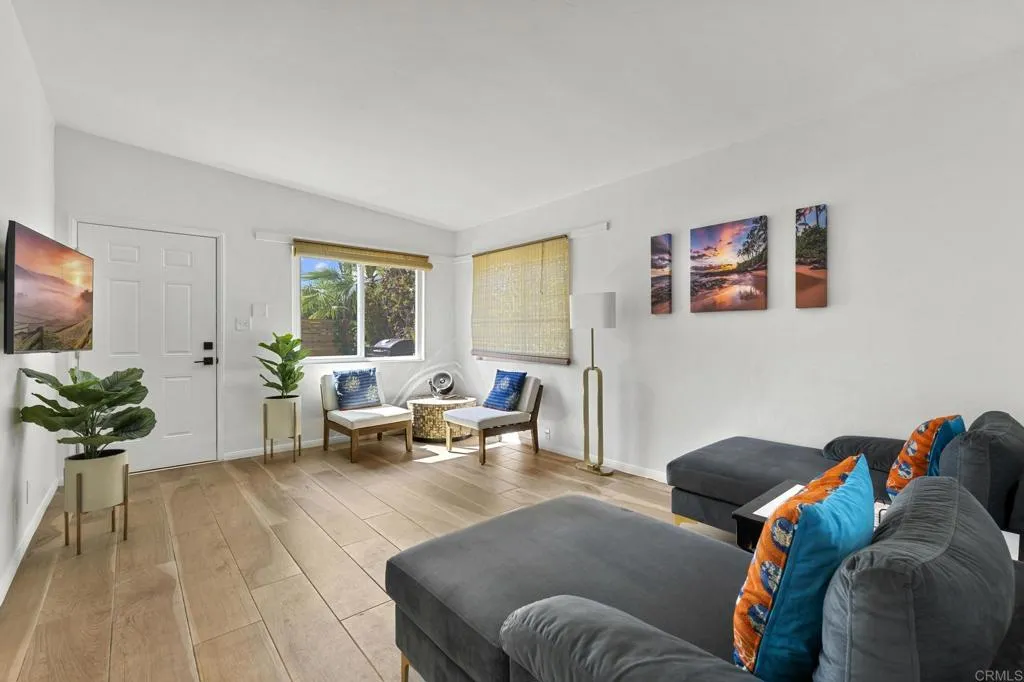 1153 Aloha Drive Encinitas, CA 92024 - Photo 10 of 50 a living room with furniture and a flat screen tv