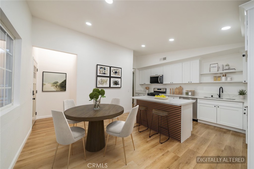 555 North Chestnut Avenue Rialto, CA 92376 - Photo 5 of 33 a kitchen with a sink cabinets and wooden floor