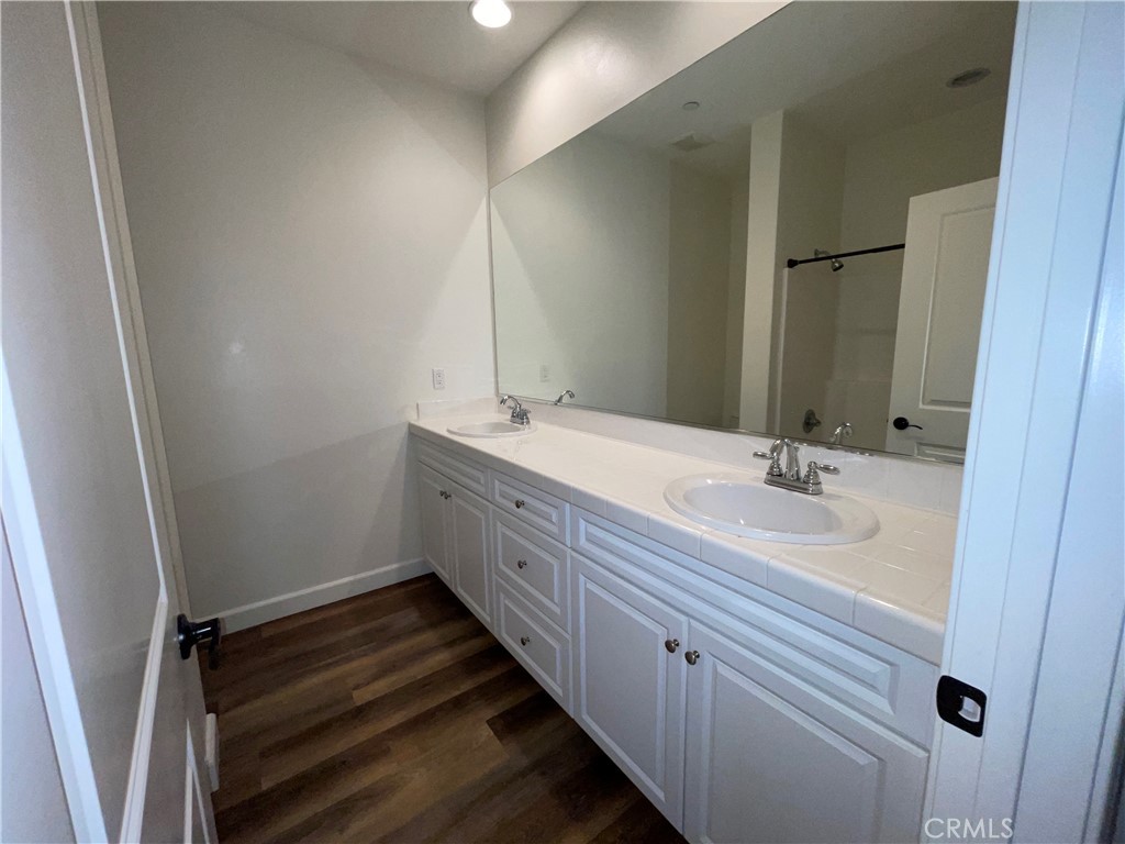 22083 Propello Drive Saugus, CA 91350 - Photo 14 of 21 a bathroom with a double vanity sink and mirror