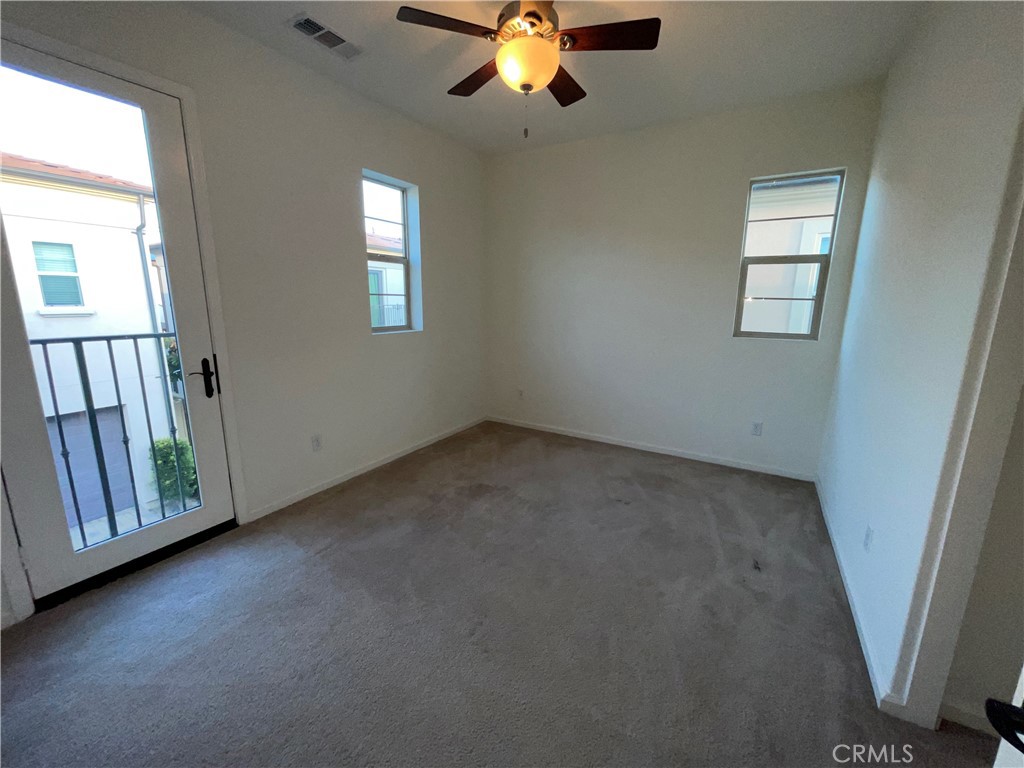 22083 Propello Drive Saugus, CA 91350 - Photo 17 of 21 an empty room with windows and fan