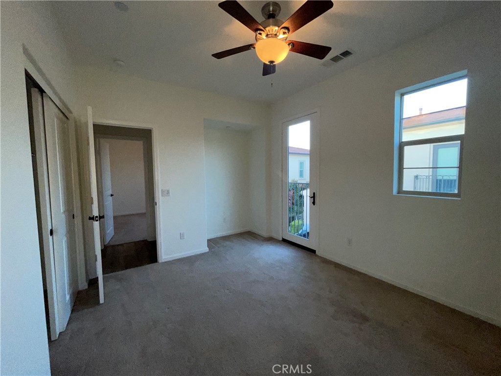 22083 Propello Drive Saugus, CA 91350 - Photo 18 of 21 an empty room with closet and a chandelier fan