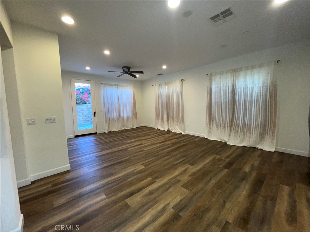 22083 Propello Drive Saugus, CA 91350 - Photo 7 of 21 a view of a hallway with wooden floor
