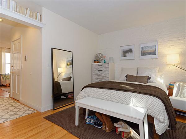 39 Gray Street, Unit 2 Boston, MA 02116 - Photo 5 of 6 a bedroom with a bed and a mirror