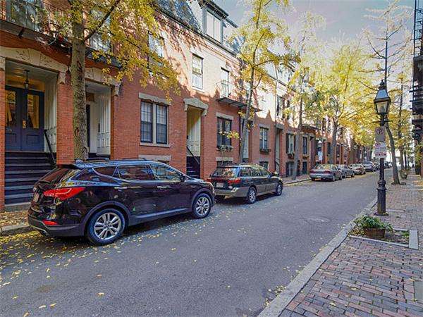39 Gray Street, Unit 2 Boston, MA 02116 - Photo 6 of 6 a car parked in front of a brick house