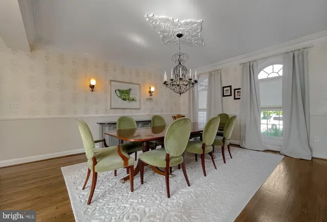 a kitchen with a sink a refrigerator and cabinets