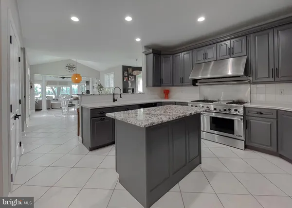 a living room with furniture a fireplace and window