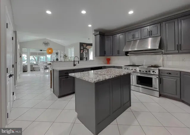 a living room with furniture a fireplace and window