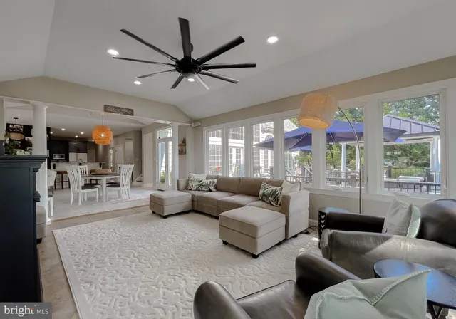 a view of a hallway with wooden floor and entryway