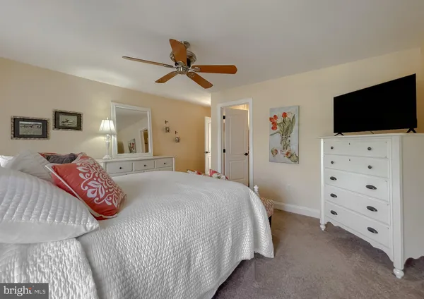 a front view of a house with a yard table and chairs