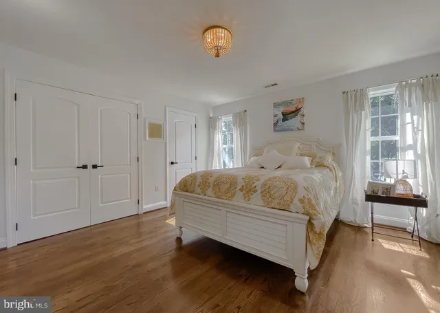 a view of a house with backyard porch and sitting area