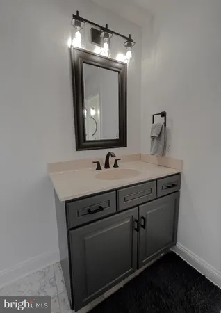 a sign that is sitting in front of house