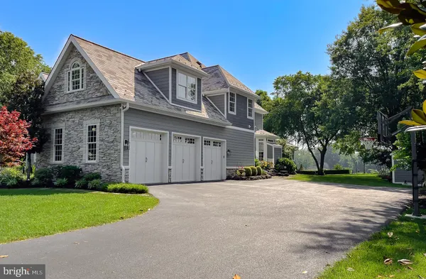 a view of entryway livingroom and hall with wooden floor