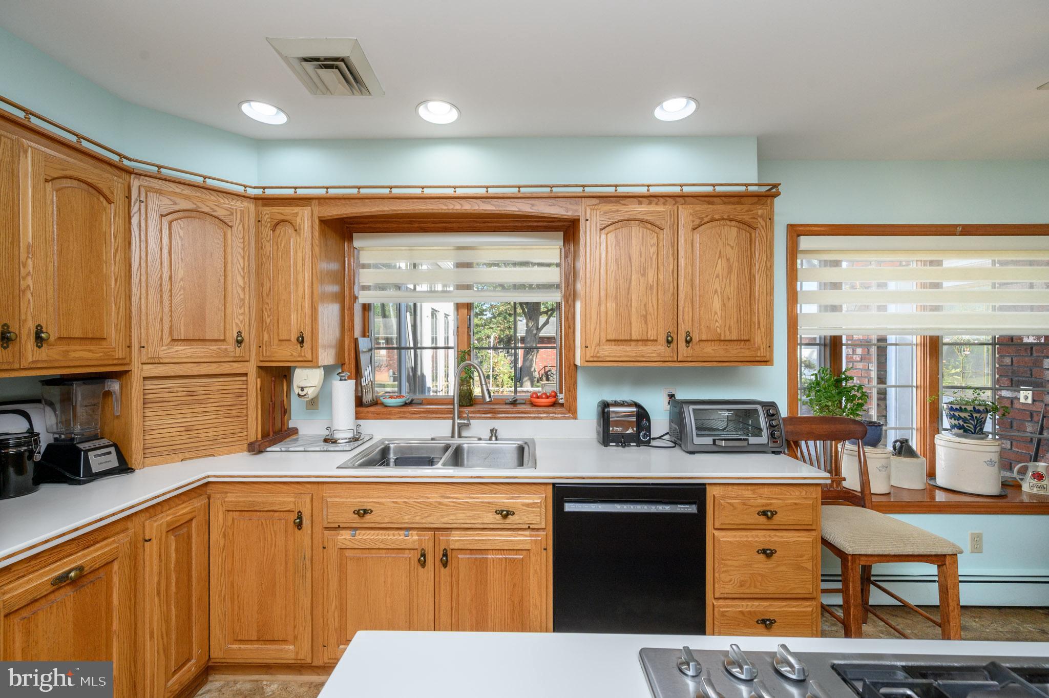 1404 Columbus Road Burlington, NJ 08016 - Photo 11 of 55 a kitchen with stainless steel appliances granite countertop a sink stove and cabinets