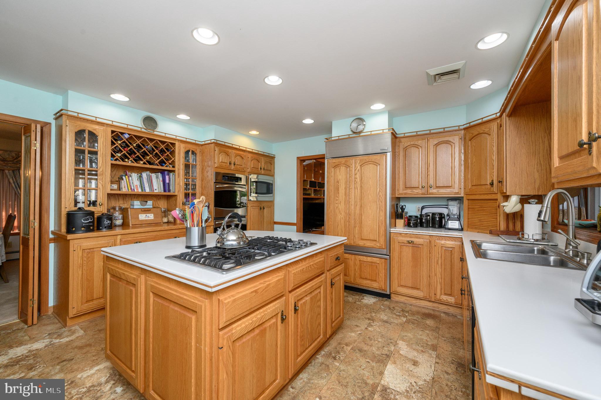 1404 Columbus Road Burlington, NJ 08016 - Photo 12 of 55 a kitchen with stainless steel appliances granite countertop a sink stove and refrigerator
