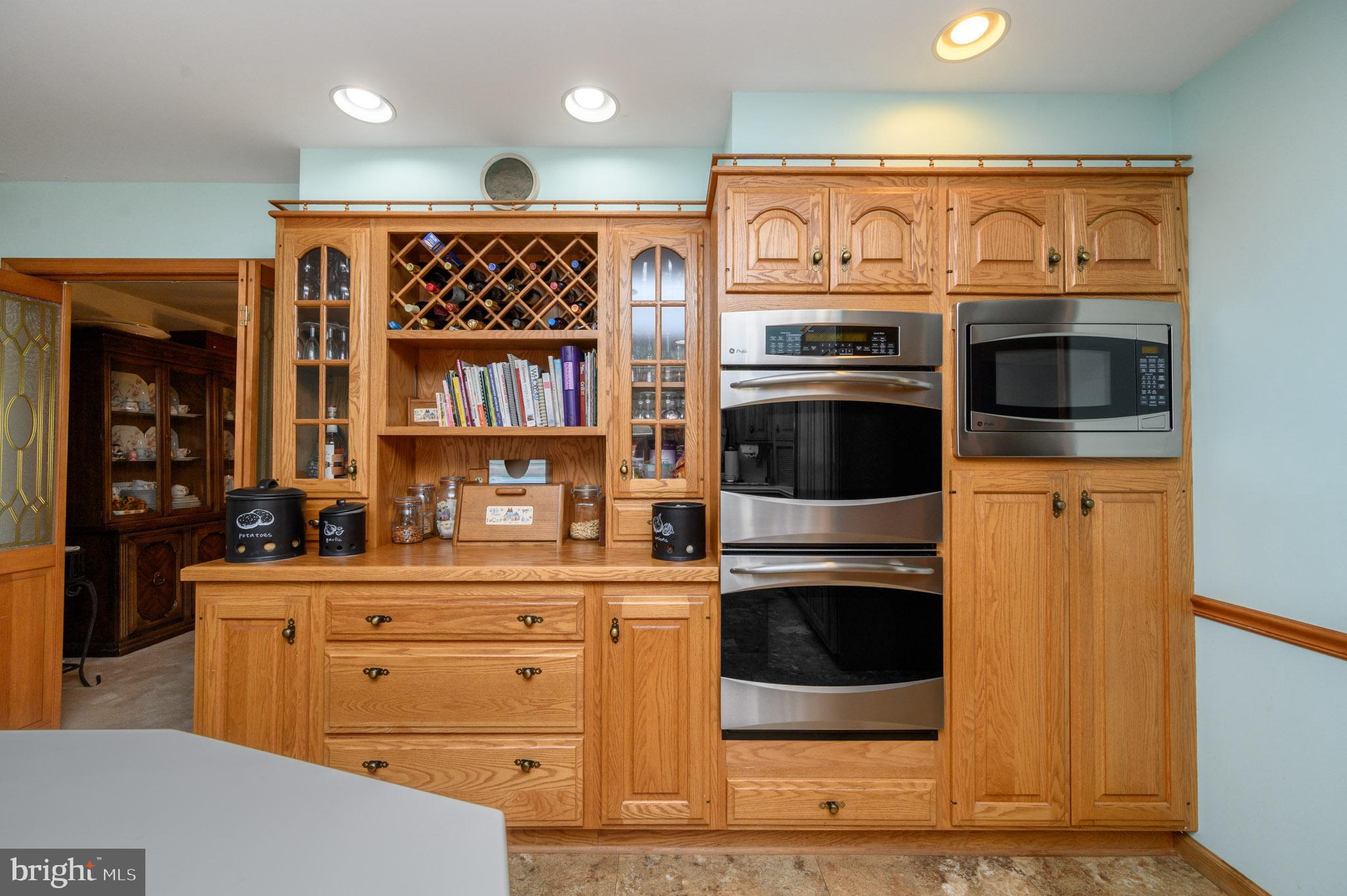 1404 Columbus Road Burlington, NJ 08016 - Photo 13 of 55 a kitchen with stainless steel appliances kitchen island granite countertop a stove and cabinets