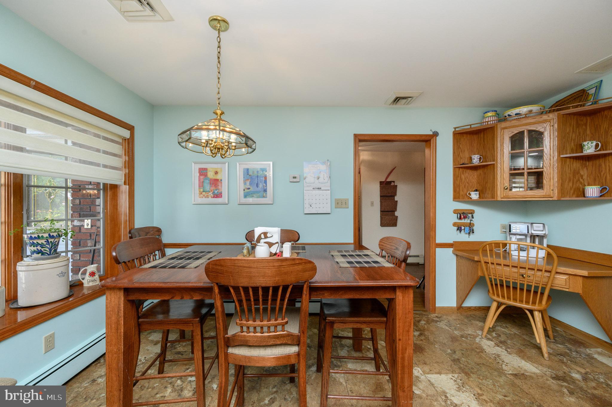 1404 Columbus Road Burlington, NJ 08016 - Photo 14 of 55 a dining room with furniture a rug and wooden floor