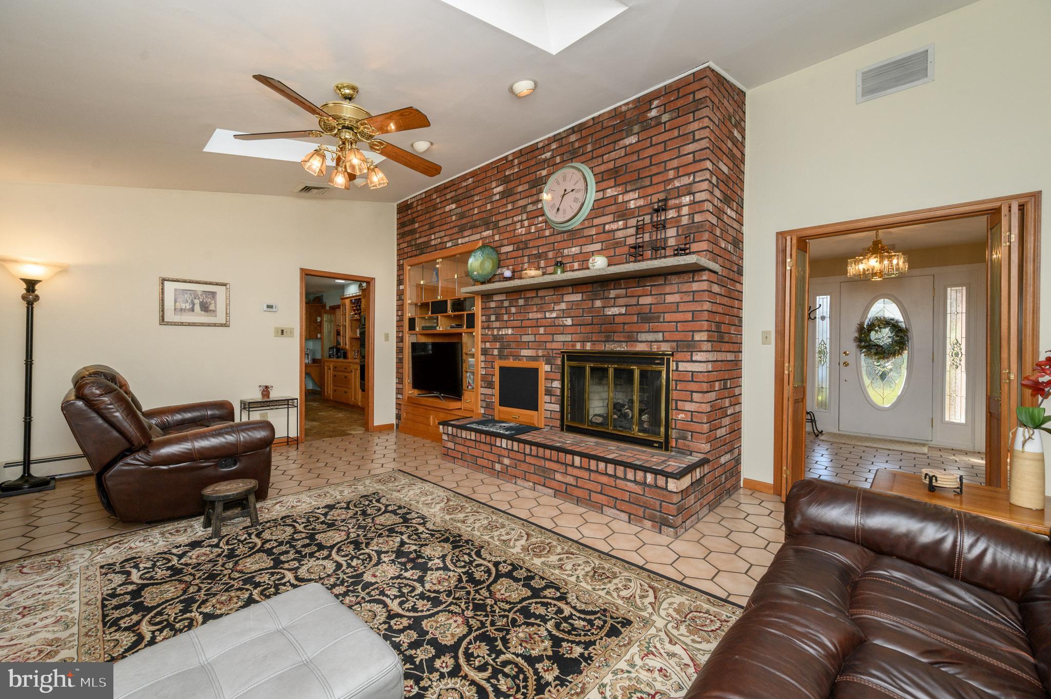 1404 Columbus Road Burlington, NJ 08016 - Photo 16 of 55 a living room with furniture and a fireplace