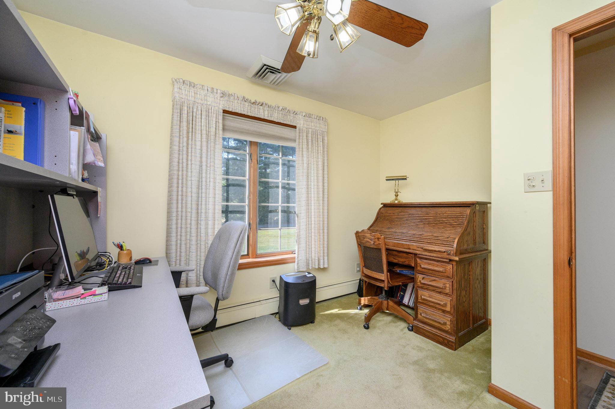 1404 Columbus Road Burlington, NJ 08016 - Photo 22 of 55 a room with furniture a flat screen tv and windows
