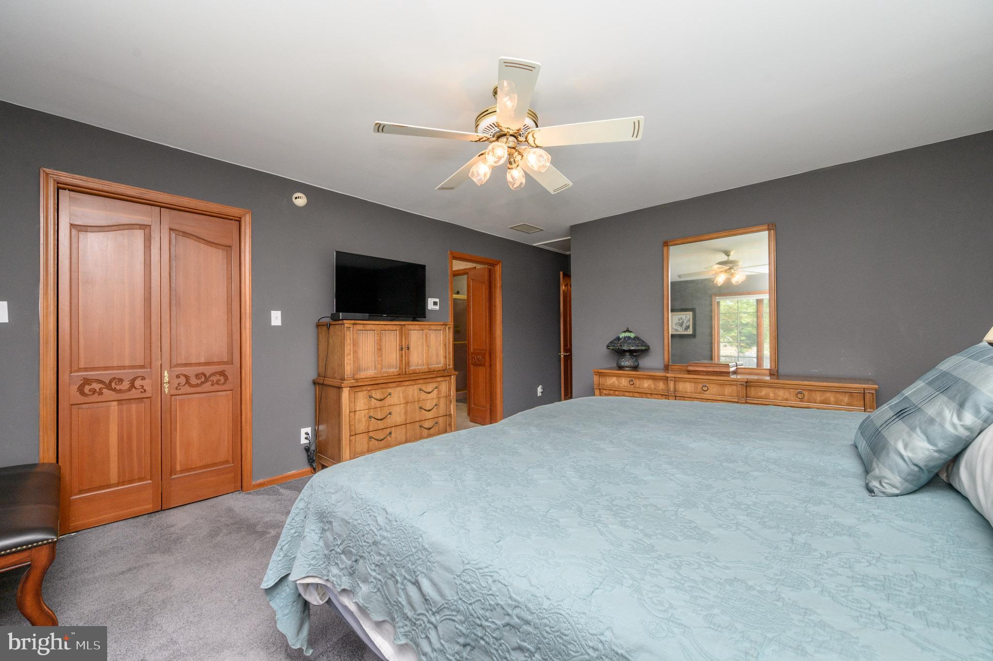 1404 Columbus Road Burlington, NJ 08016 - Photo 29 of 55 a bedroom with a bed and a chandelier