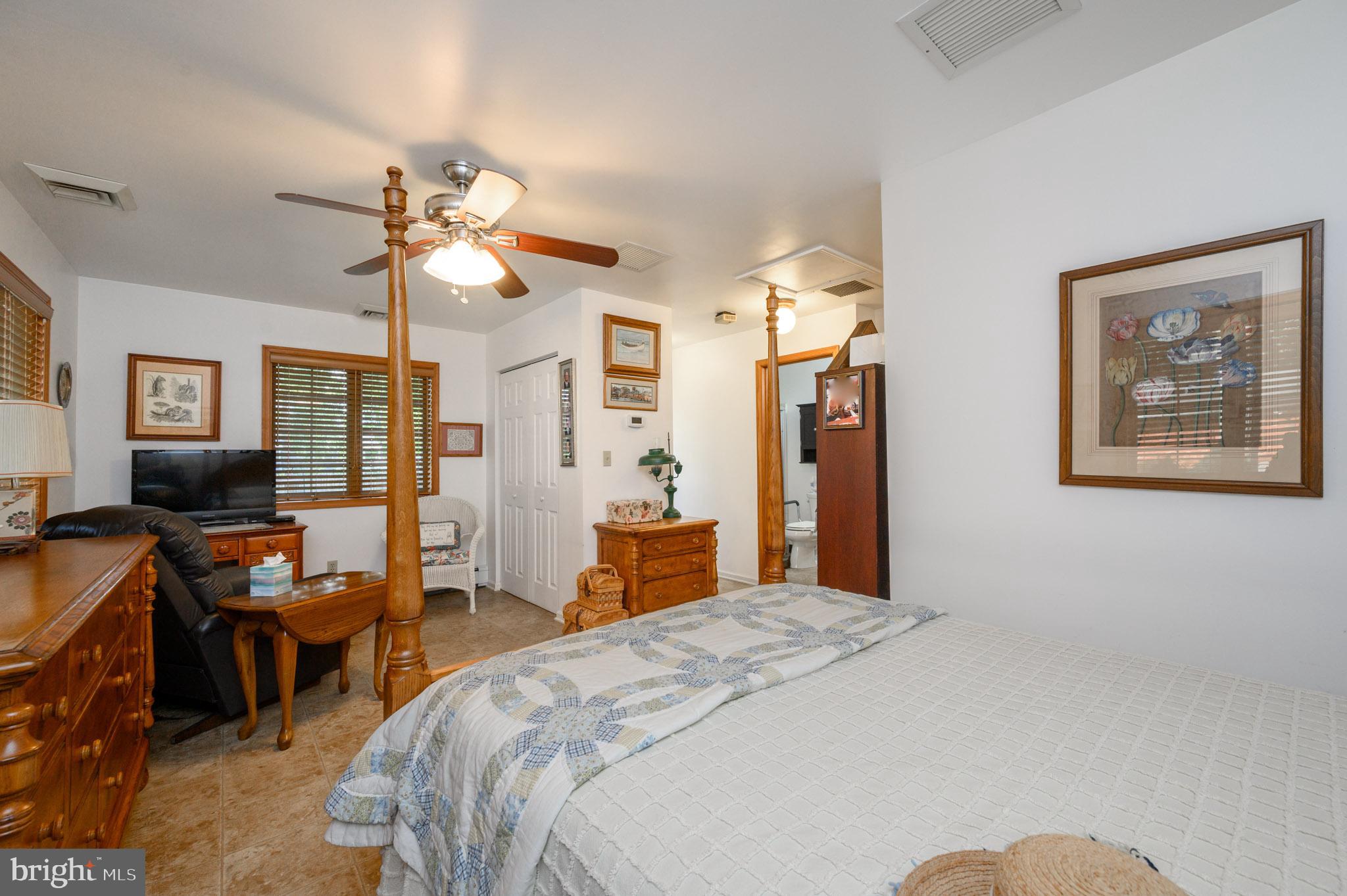 1404 Columbus Road Burlington, NJ 08016 - Photo 34 of 55 a bedroom with a bed and wooden floor