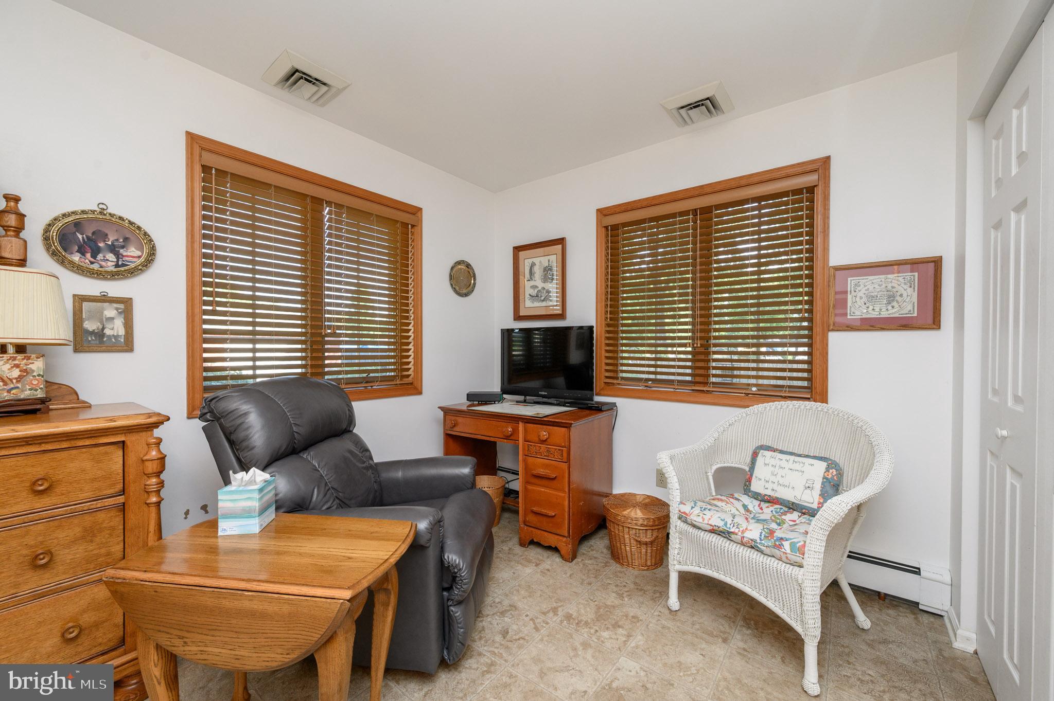 1404 Columbus Road Burlington, NJ 08016 - Photo 35 of 55 a living room with furniture and a flat screen tv