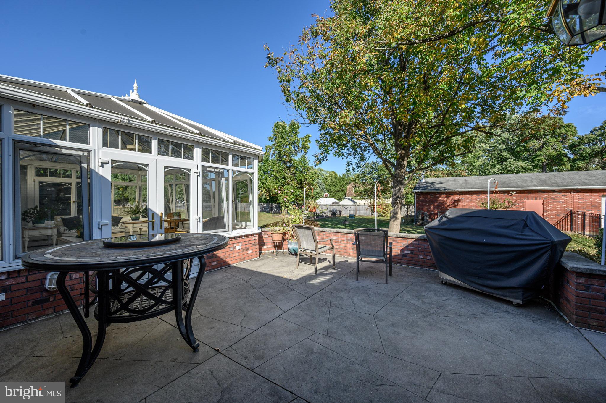 1404 Columbus Road Burlington, NJ 08016 - Photo 43 of 55 a view of a patio with a table and chairs