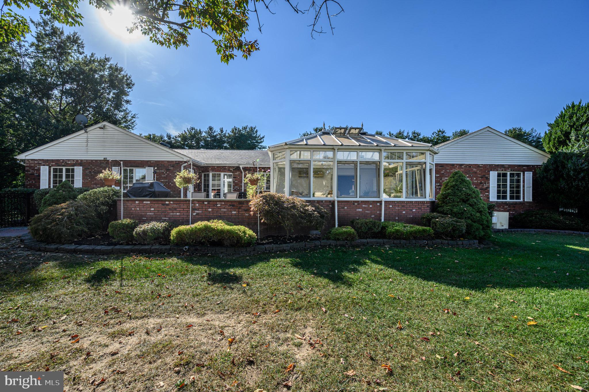 1404 Columbus Road Burlington, NJ 08016 - Photo 44 of 55 a front view of a house with a garden and yard