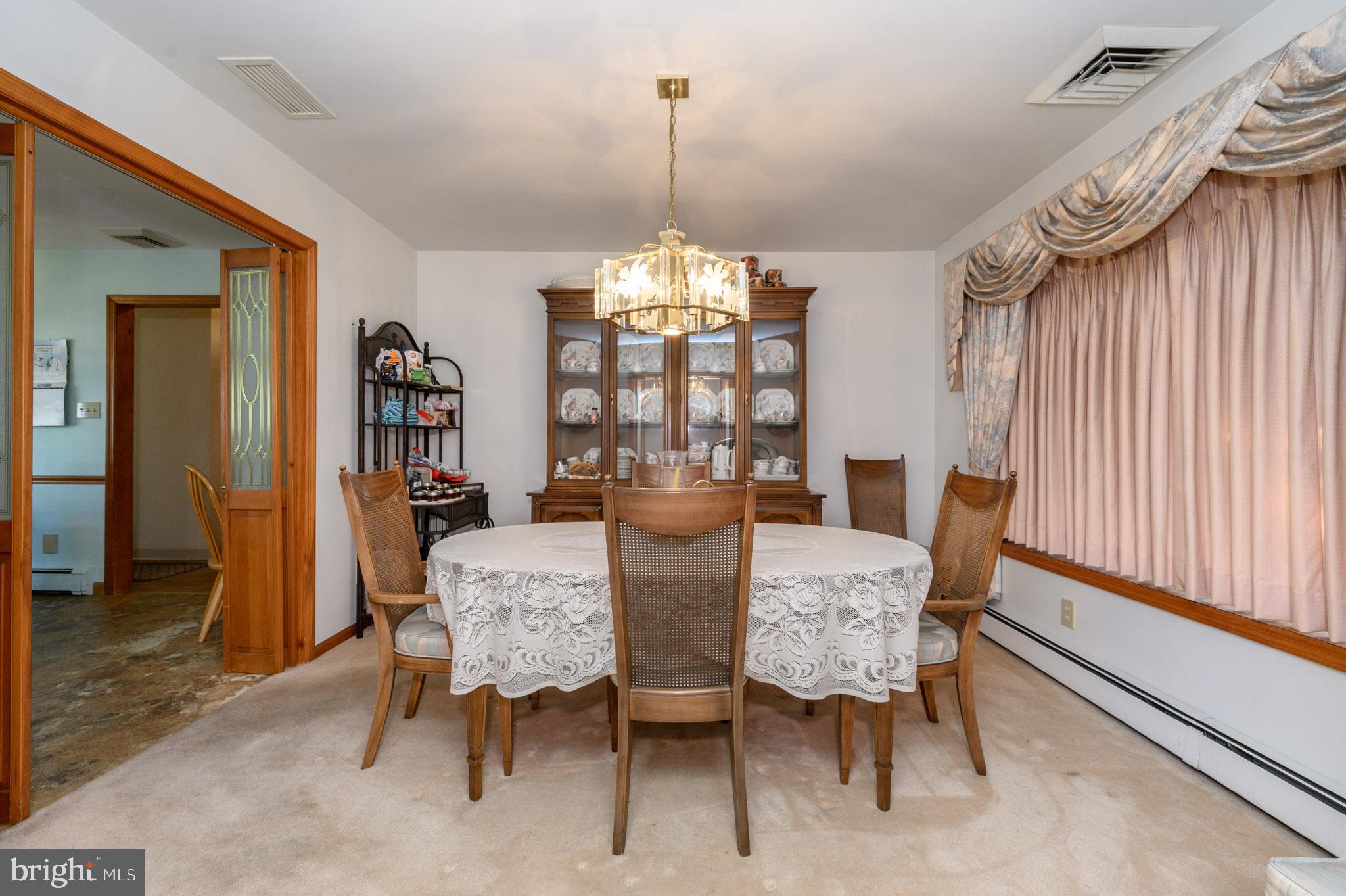 1404 Columbus Road Burlington, NJ 08016 - Photo 6 of 55 a view of a dining room with furniture window and wooden floor
