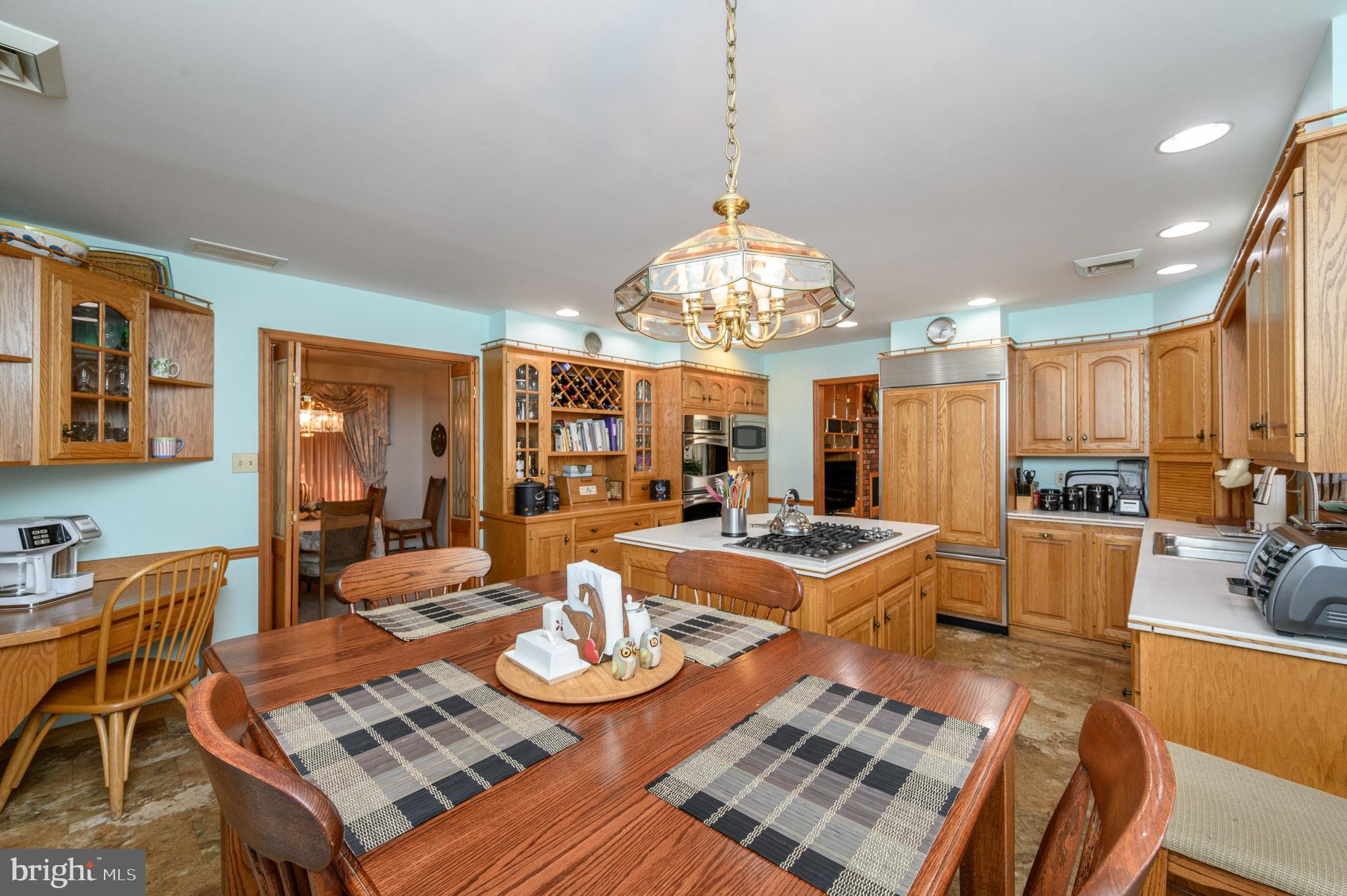 1404 Columbus Road Burlington, NJ 08016 - Photo 9 of 55 a view of a dining room with furniture a chandelier and wooden floor