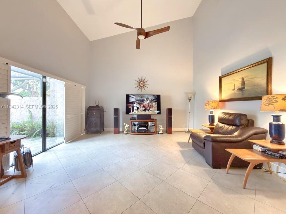 205 Bonnie Brae Way, Unit 33 Hollywood, FL 33021 - Photo 11 of 43 a living room with furniture and a flat screen tv