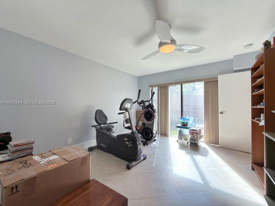 205 Bonnie Brae Way, Unit 33 Hollywood, FL 33021 - Photo 16 of 43 a view of a workspace with furniture and a window