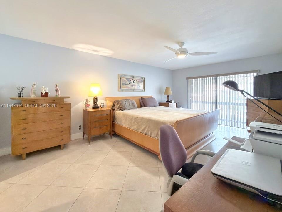 205 Bonnie Brae Way, Unit 33 Hollywood, FL 33021 - Photo 19 of 43 a bedroom with a bed and a night stand