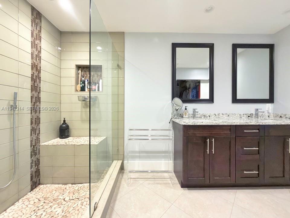 205 Bonnie Brae Way, Unit 33 Hollywood, FL 33021 - Photo 23 of 43 a bathroom with a sink and a mirror