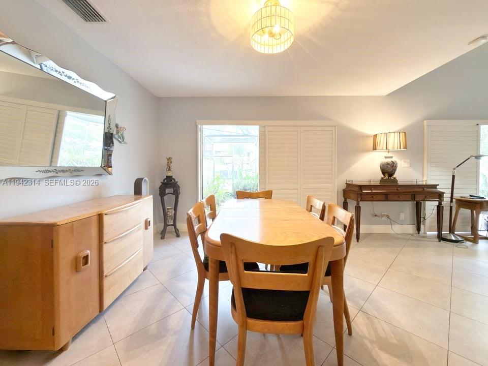 205 Bonnie Brae Way, Unit 33 Hollywood, FL 33021 - Photo 9 of 43 a large kitchen with a table and chairs