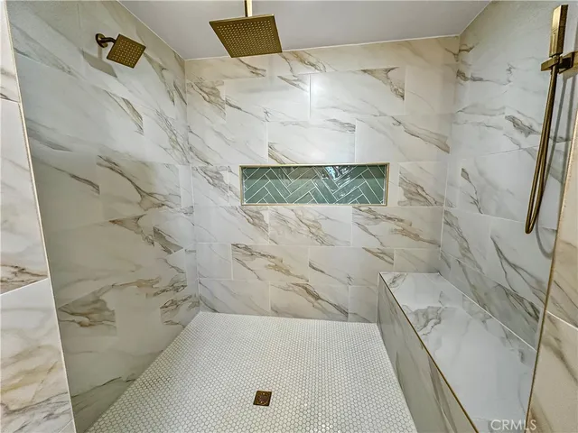 a bathroom with a shower and a sink