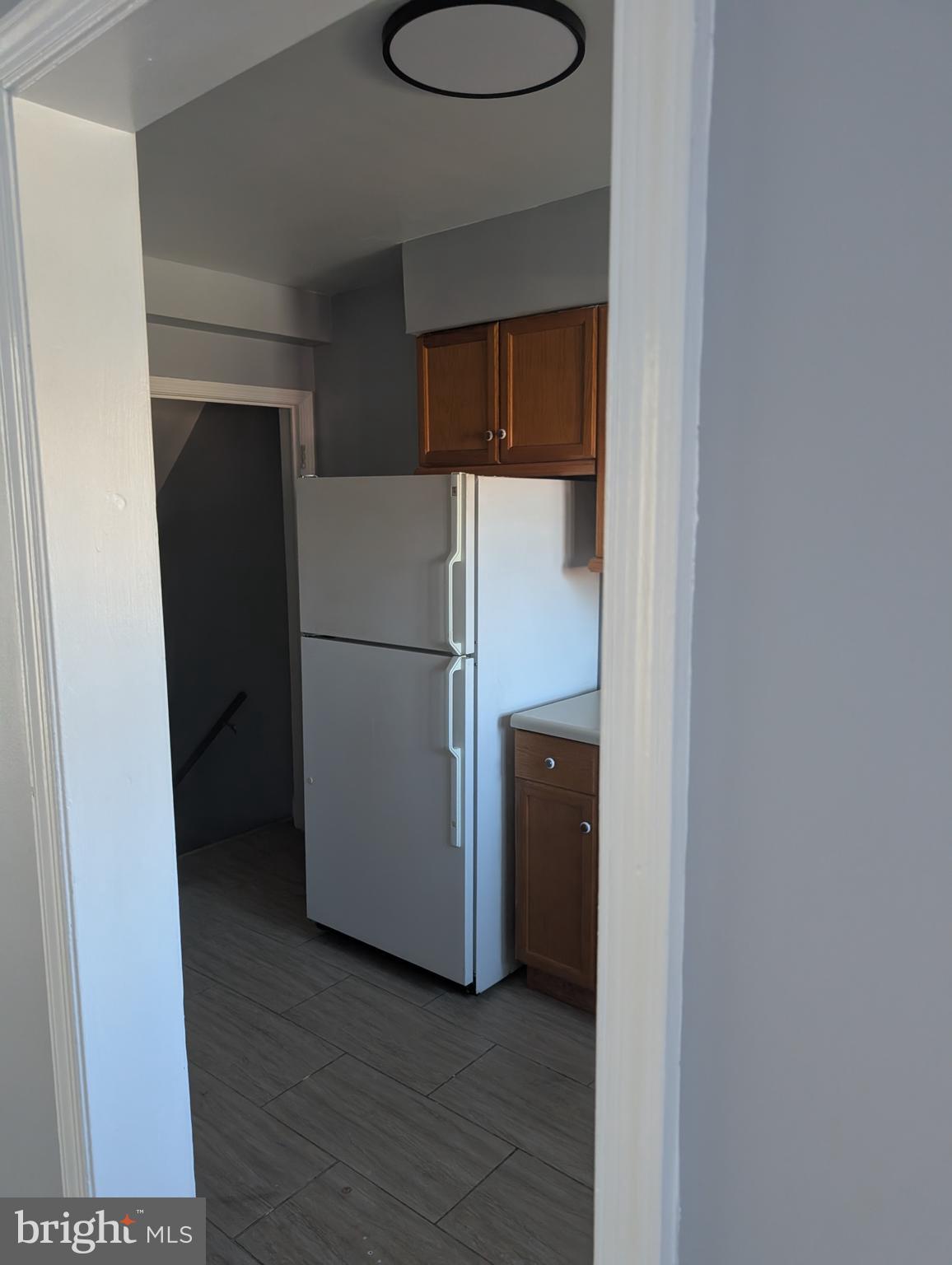 3011 Larue Square East Baltimore, MD 21225 - Photo 6 of 19 a view of a room with wooden floor and a sink
