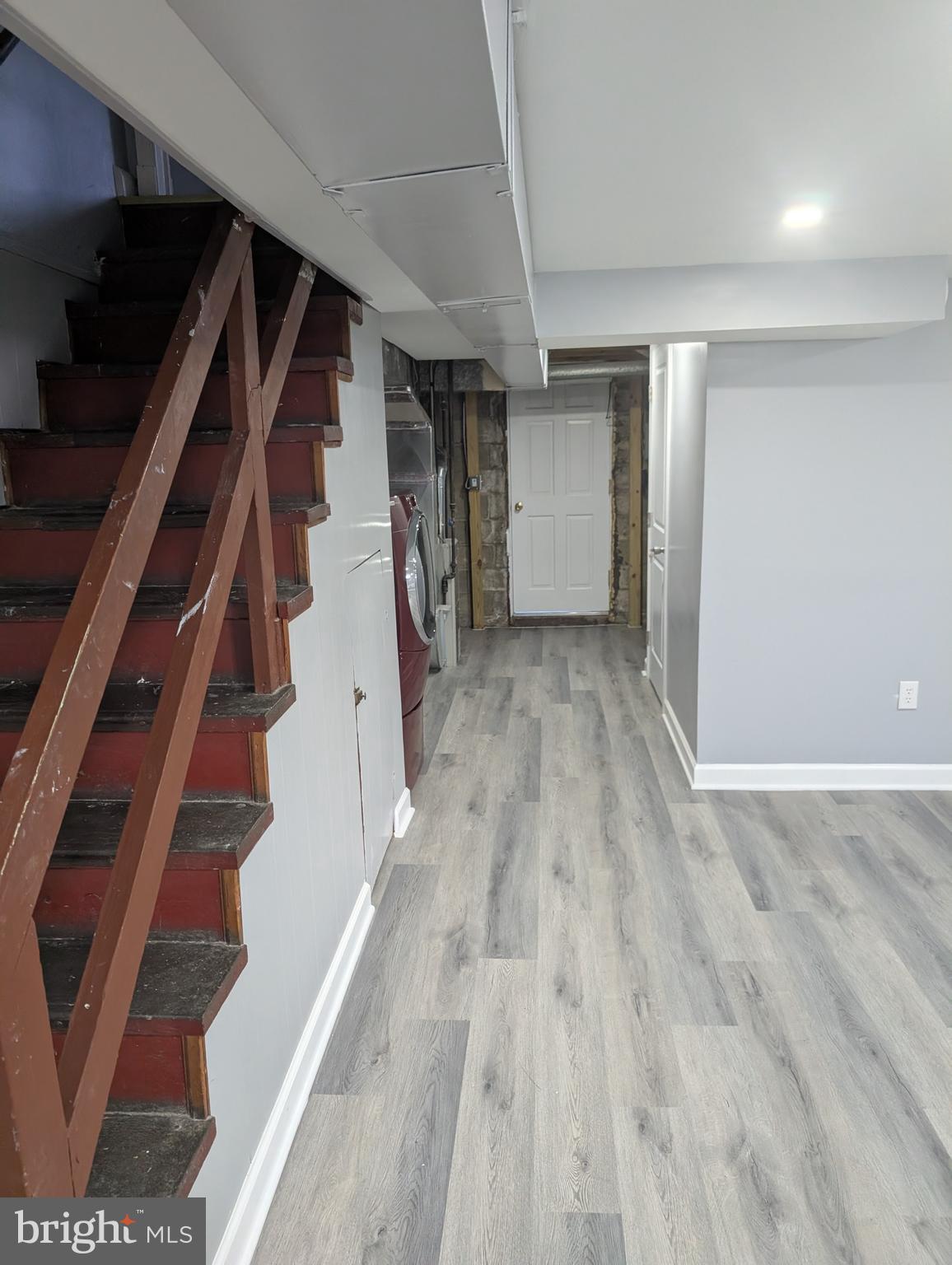 3011 Larue Square East Baltimore, MD 21225 - Photo 10 of 19 a view of an empty room with wooden floor