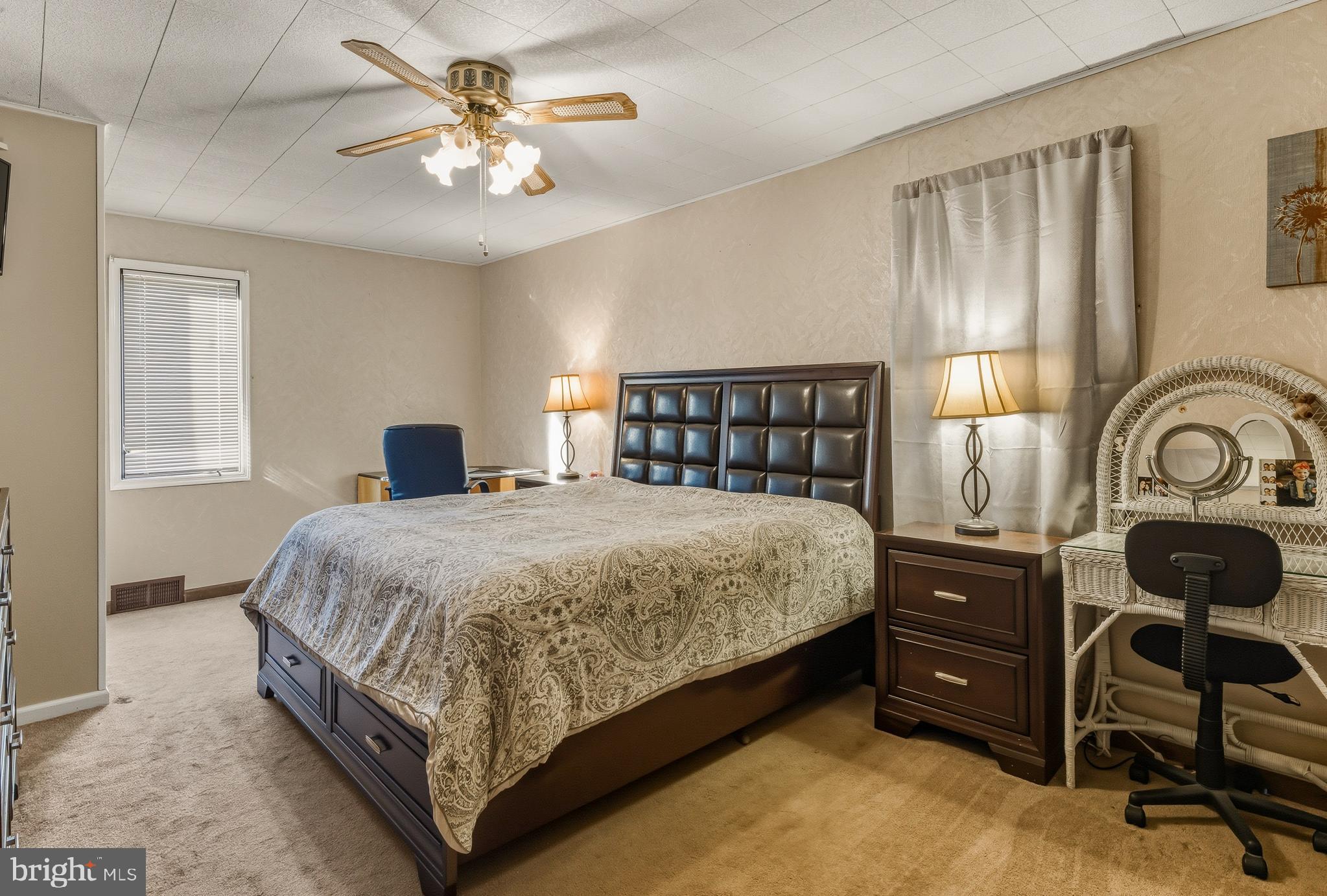 30 St Charles Place Runnemede, NJ 08078 - Photo 10 of 21 a bedroom with a bed and a chandelier